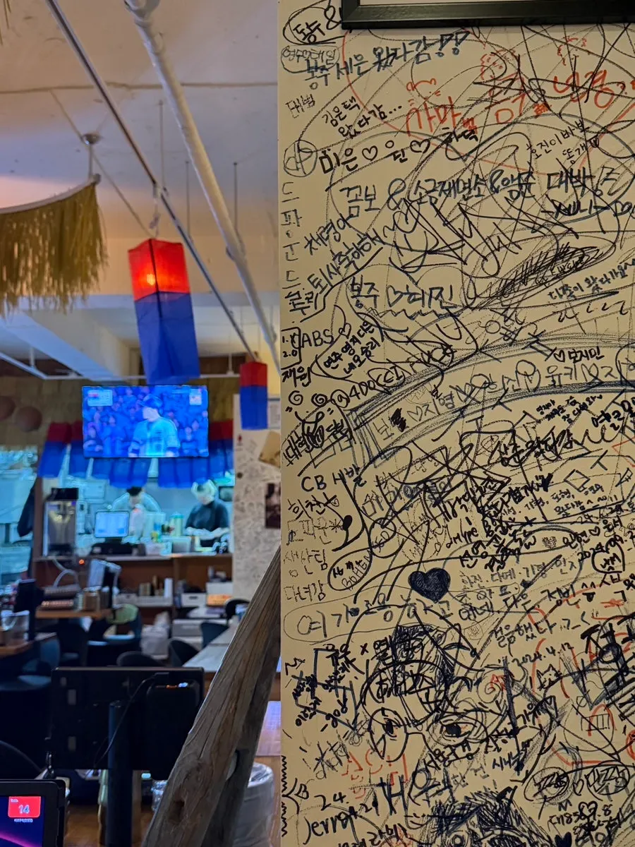 Wall at Bako Jumak covered in graffiti left by customers