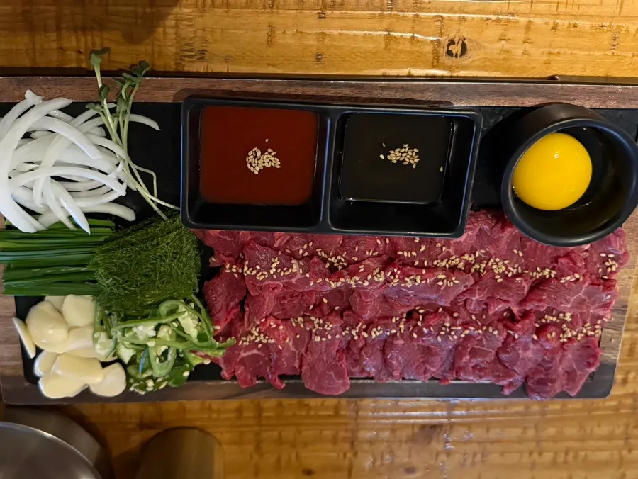 Beef sashimi table setting with salt-oil sauce and other sauces