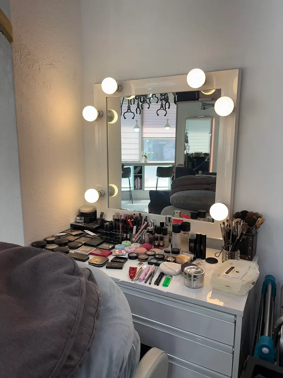 Hair salon interior with bright lighting and mirrors