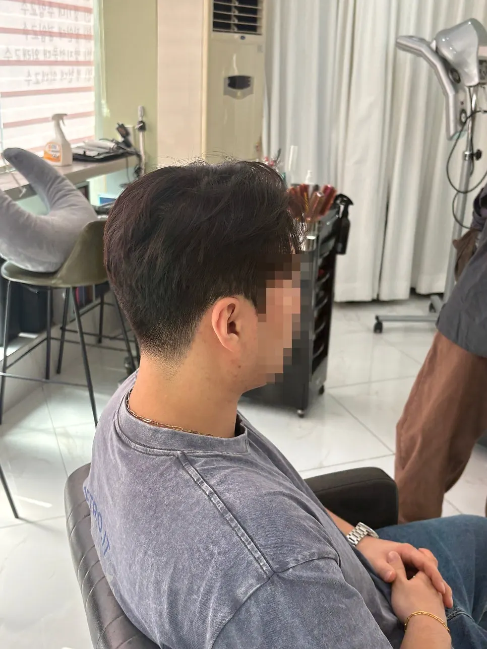 Before-and-after view of a neat men’s hairstyle