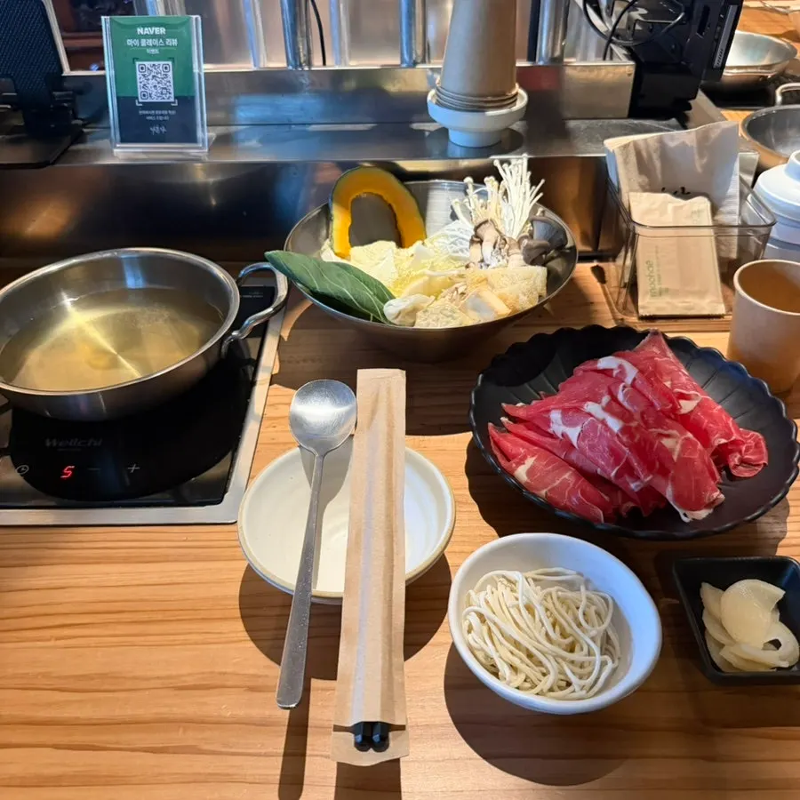 Clear broth shabu-shabu pot starting to boil