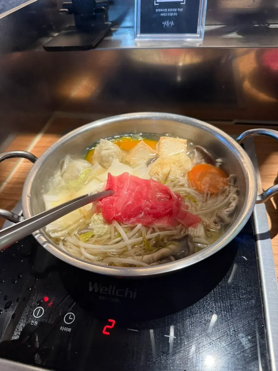 Shabu-shabu meat dipped in peanut sauce