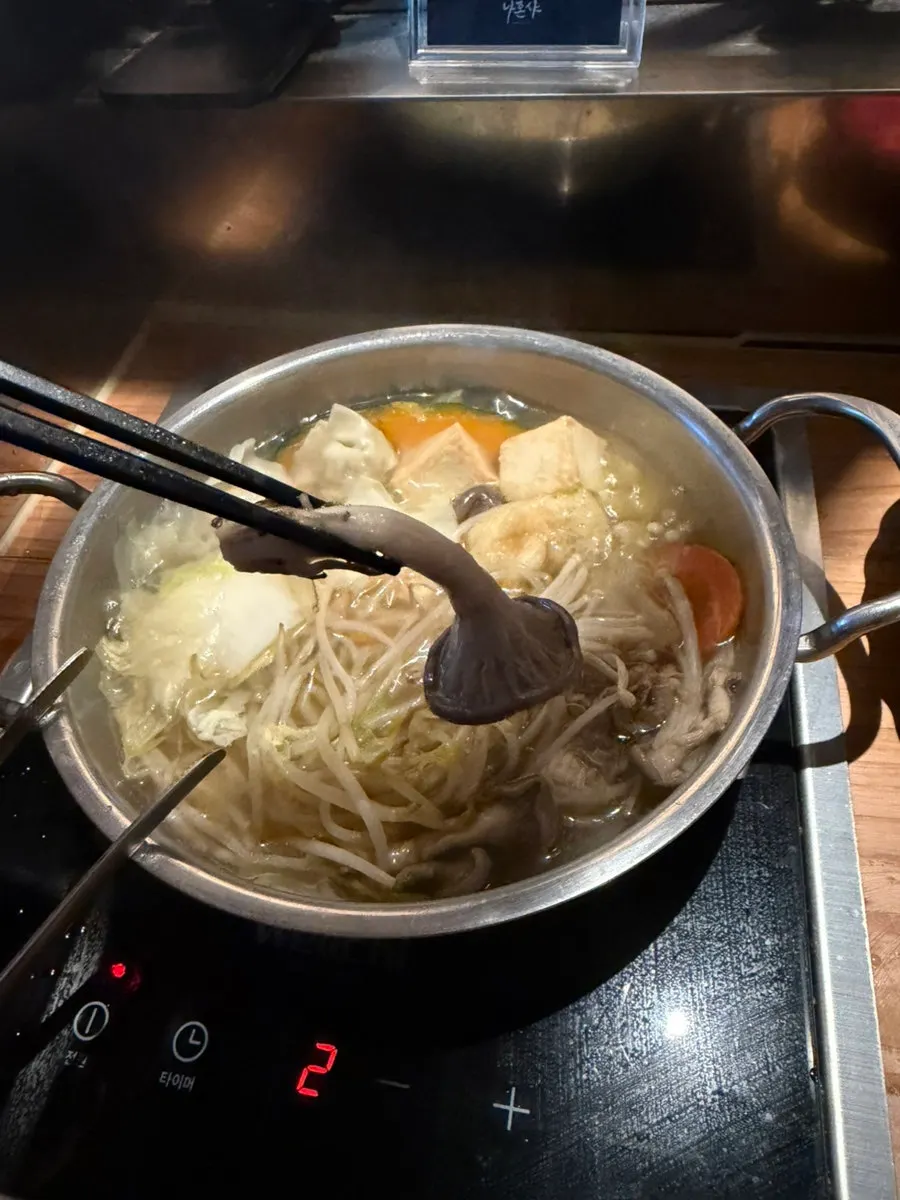 A bite of well-cooked bean sprouts and vegetables