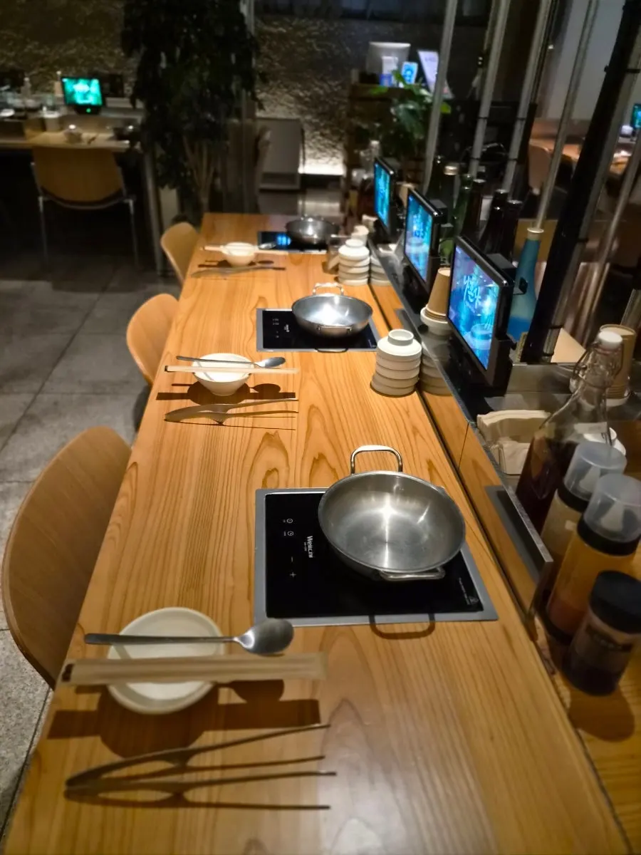 Interior of Nahonsha with wood-toned tables