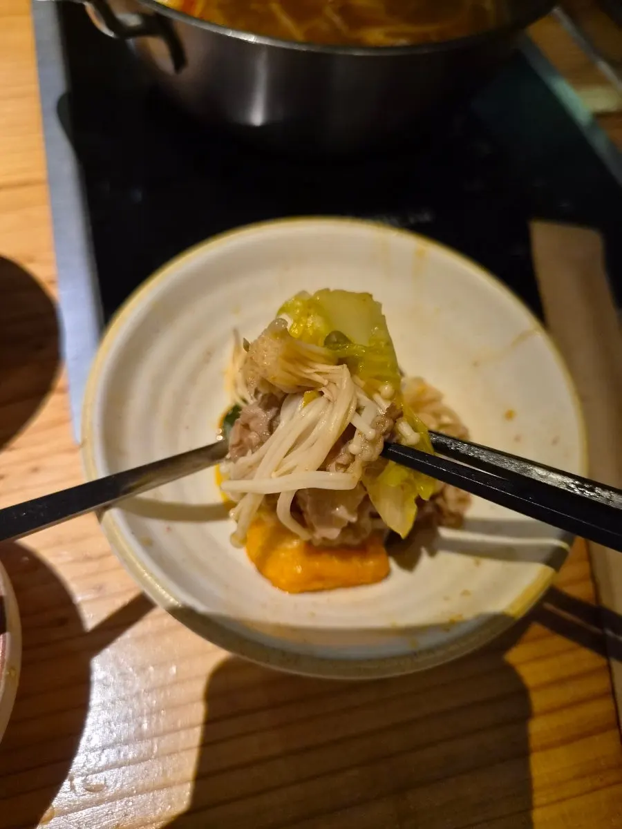 Shabu-shabu meat dipped in peanut sauce
