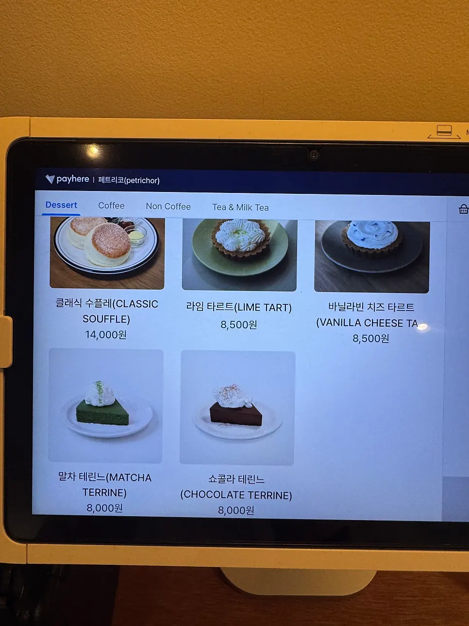 Menu board listing soufflé and tart