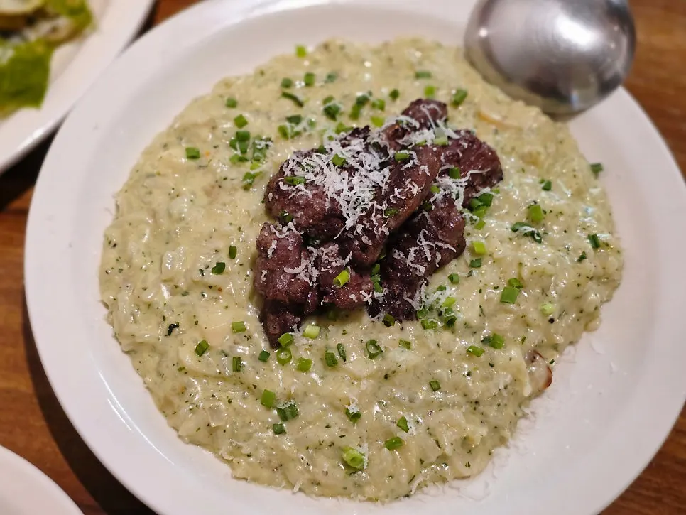A plate of Riike's short rib basil risotto