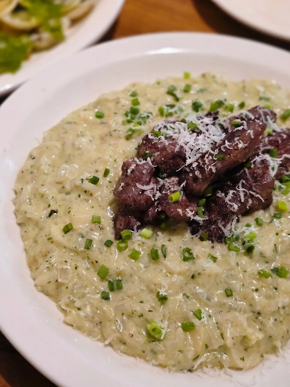 Basil risotto piled high with short rib