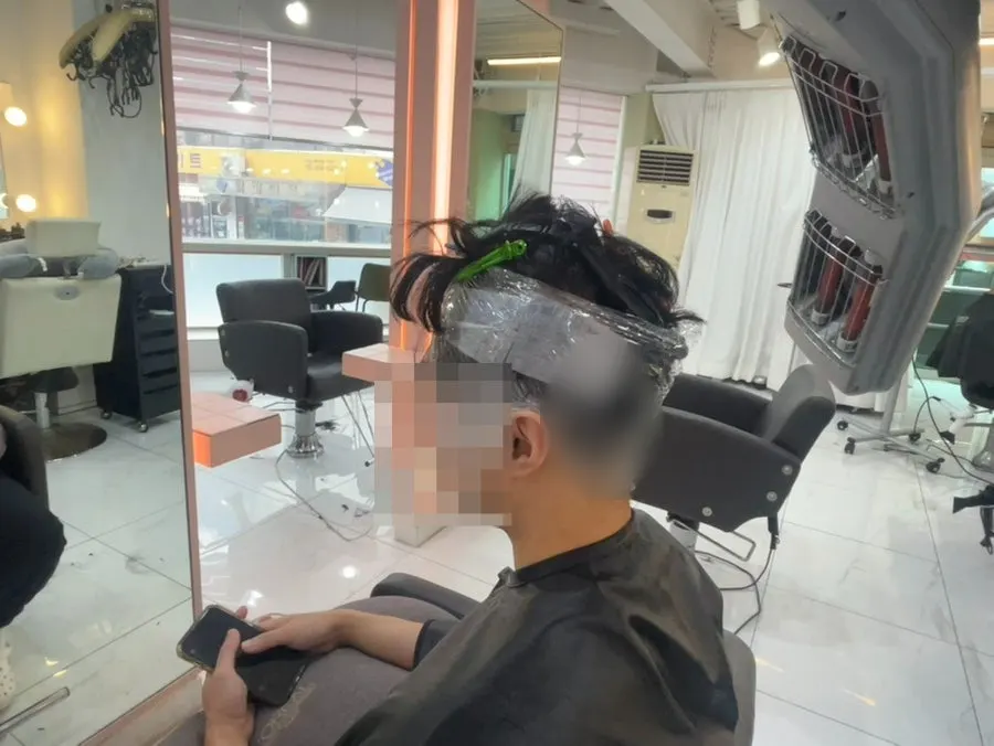 The finished men's hairstyle after the service