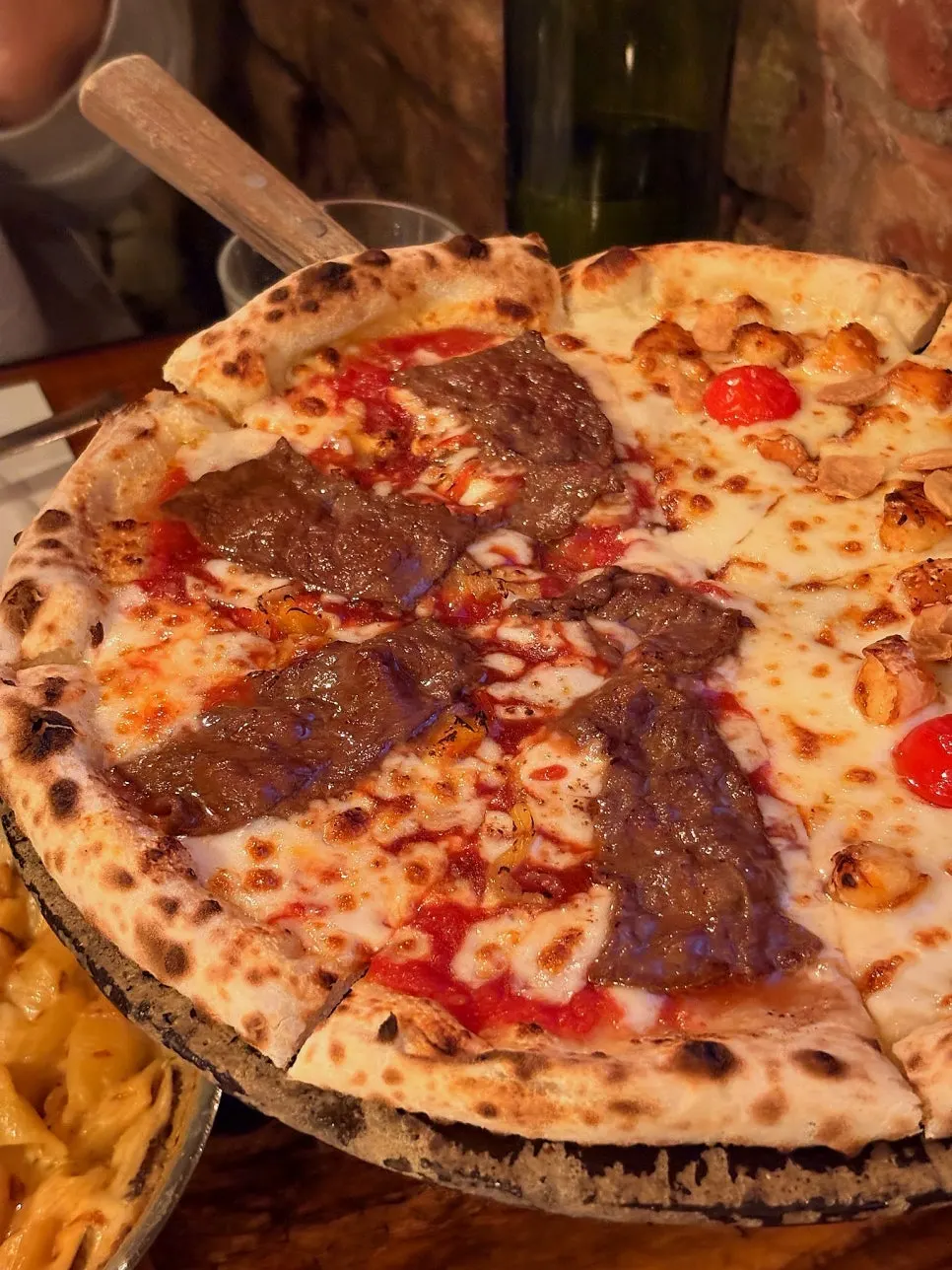 Close-up of the beef-topped Manjo pizza side