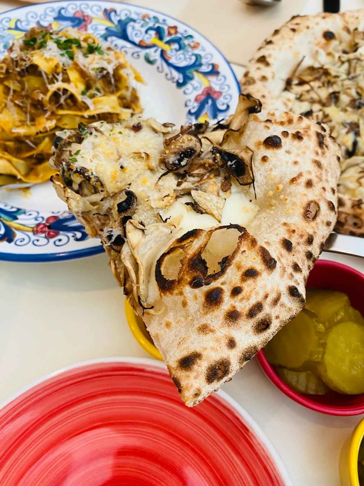 Wood-fired quattro funghi pizza topped with mushrooms