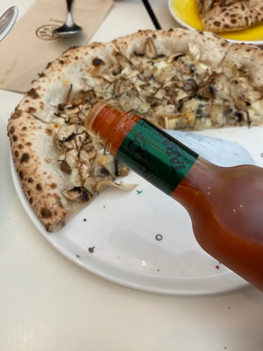 Cross-section of pizza with mushrooms and cheese