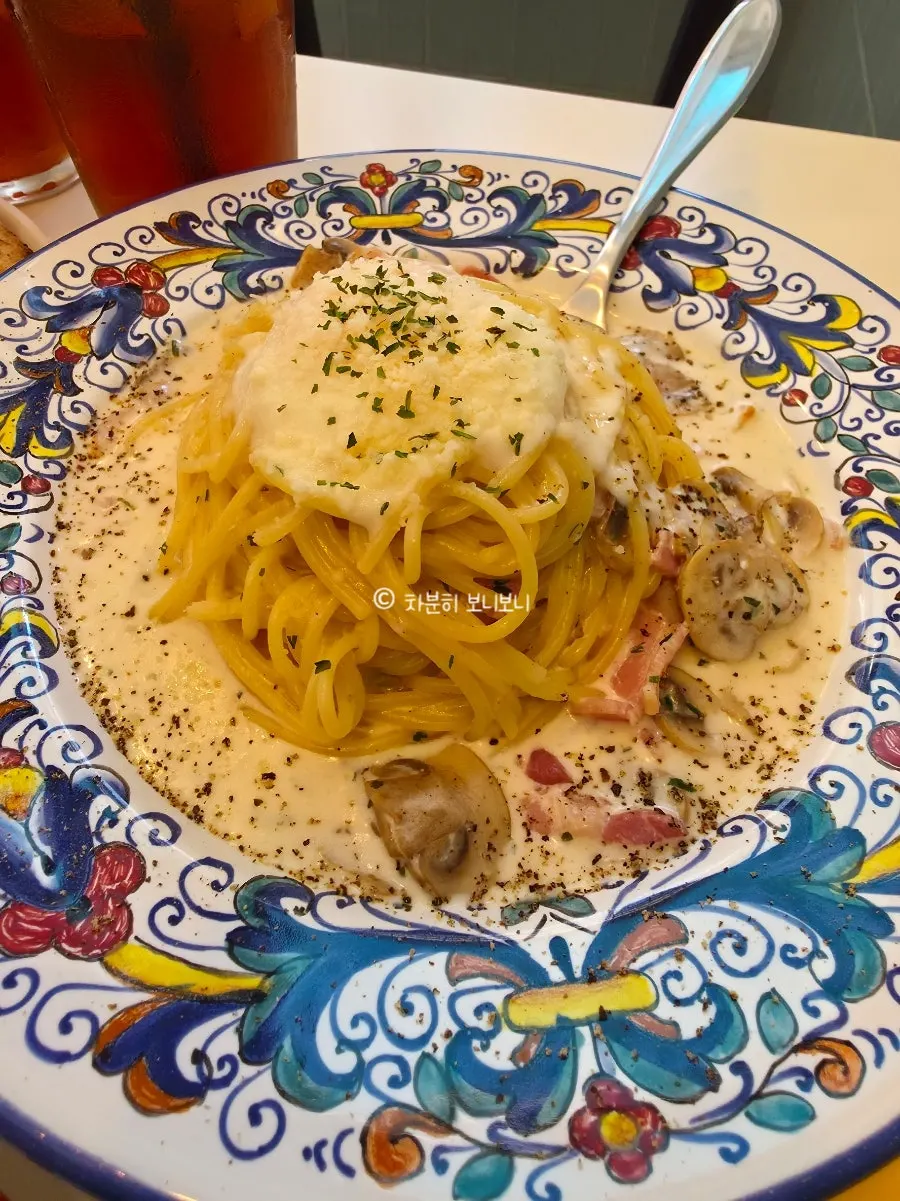 Carbonara pasta topped with a poached egg