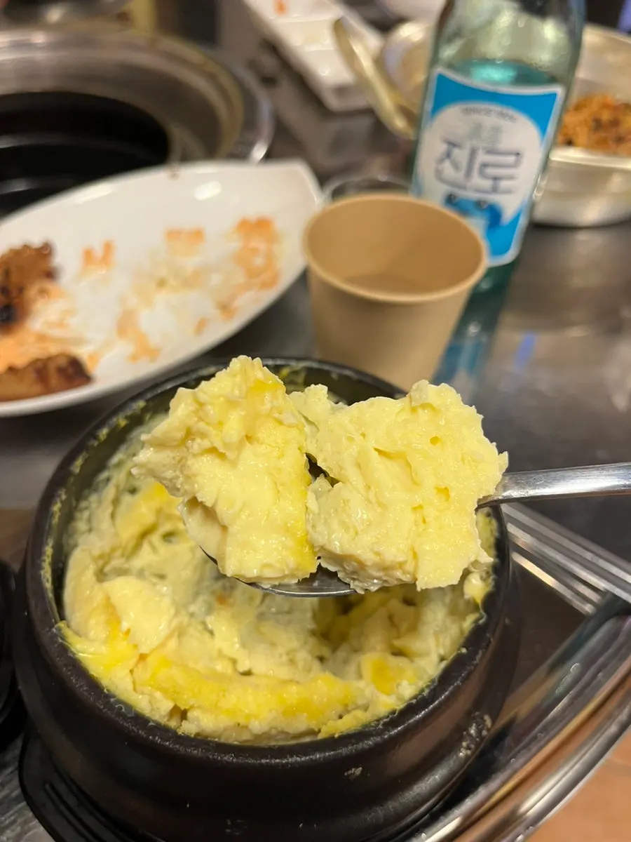 Soju glass and jjokgalbi spread on the table