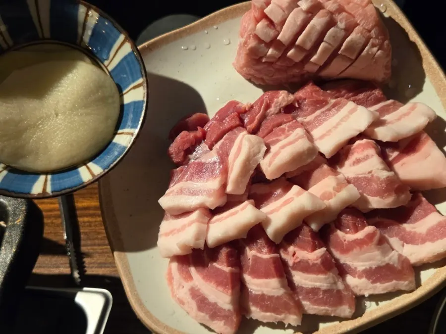 Staff grilling the pork belly