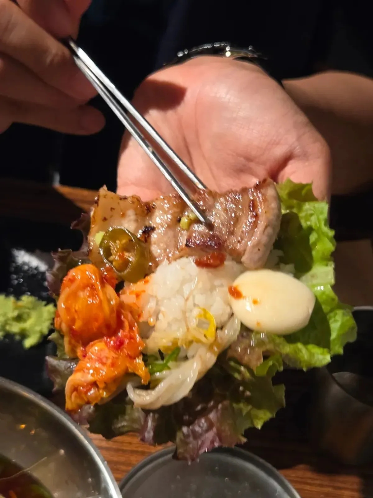A bowl of naengmyeon eaten alongside the meat