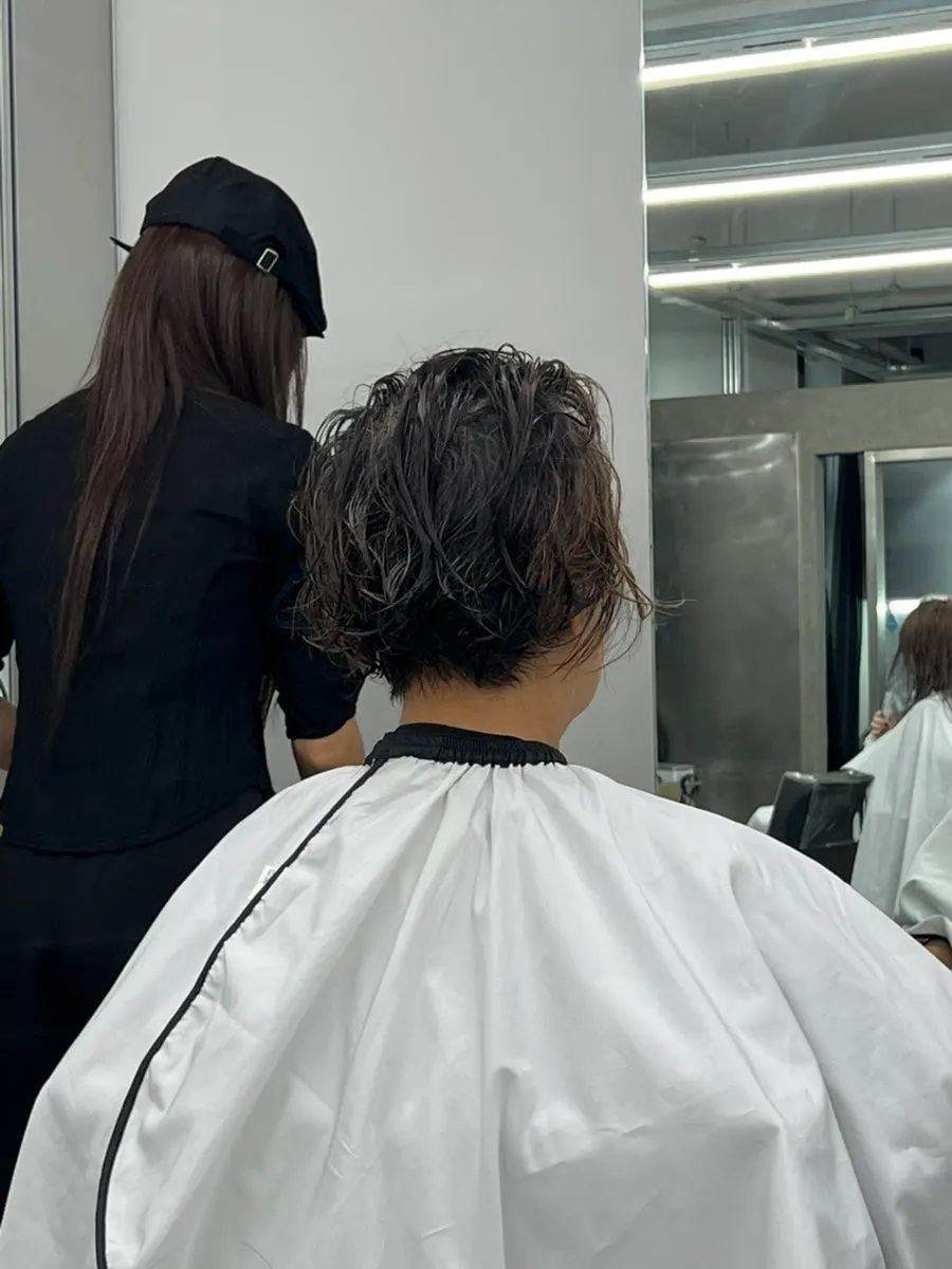 Careful shampooing before the root perm