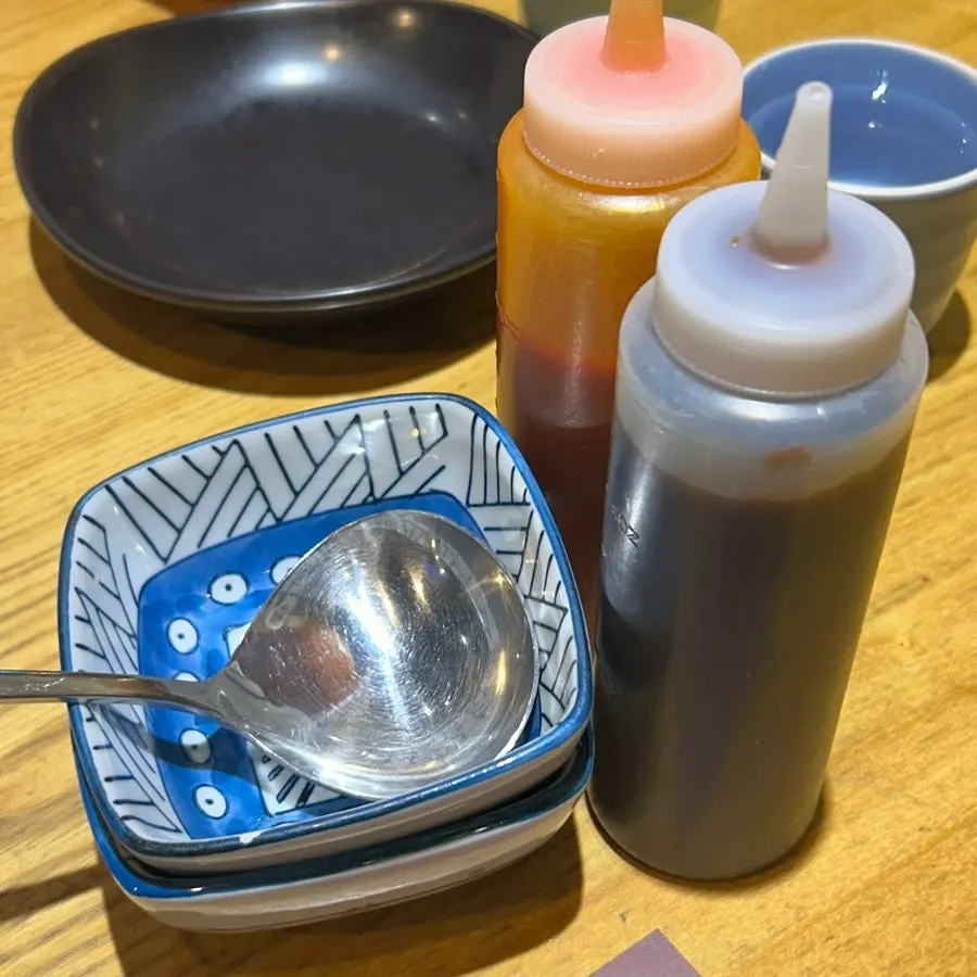 Hoisin sauce and chili sauce served with the pho