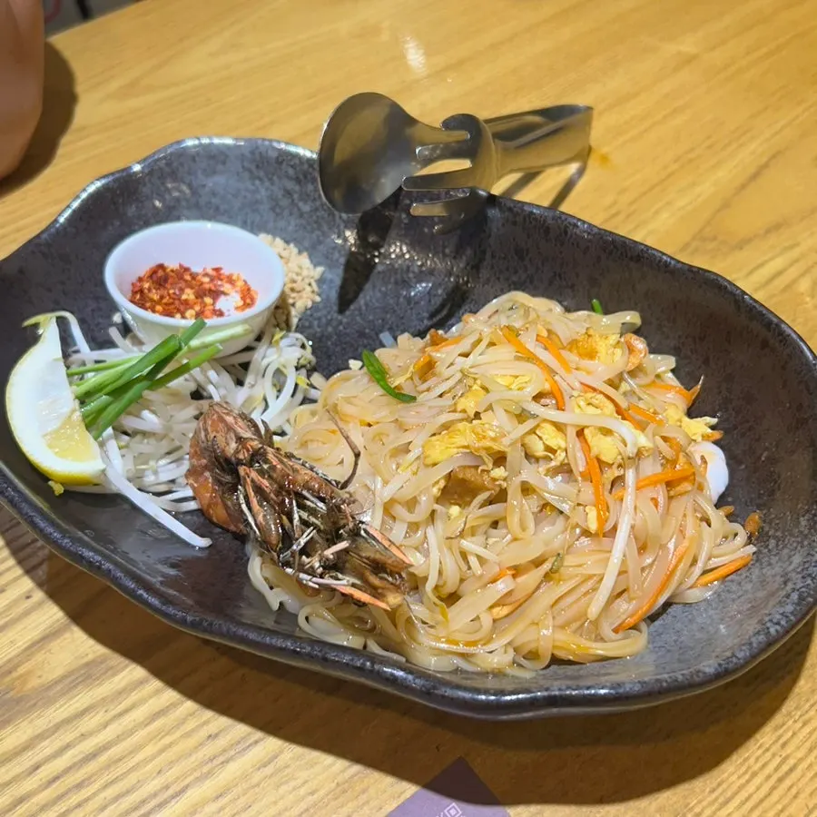 Giant prawn pad thai topped with large prawns
