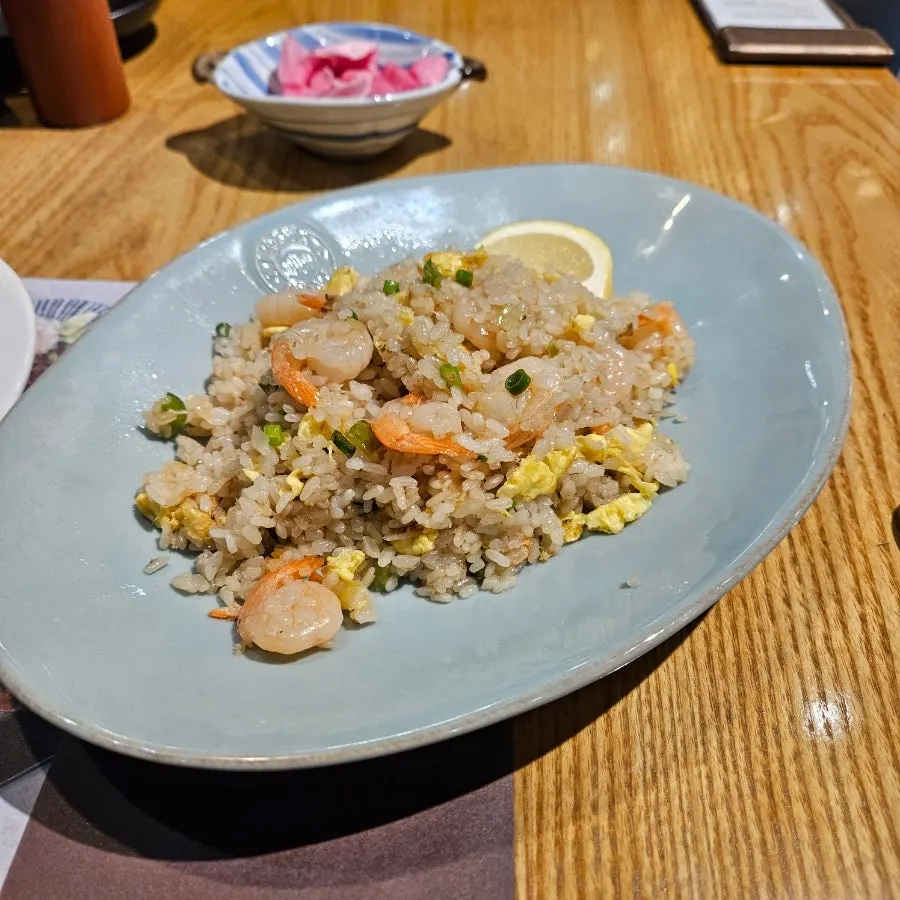 A plate of shrimp crab fried rice