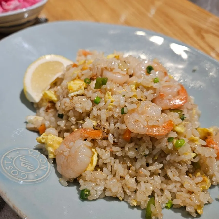 Close-up of fried rice with visible shrimp and crab meat
