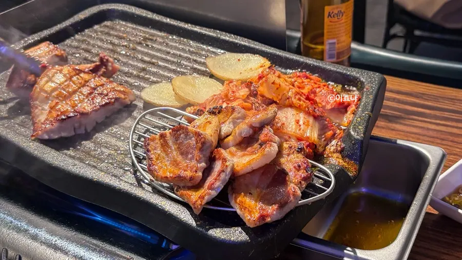 Thick pork belly grilling on the pan