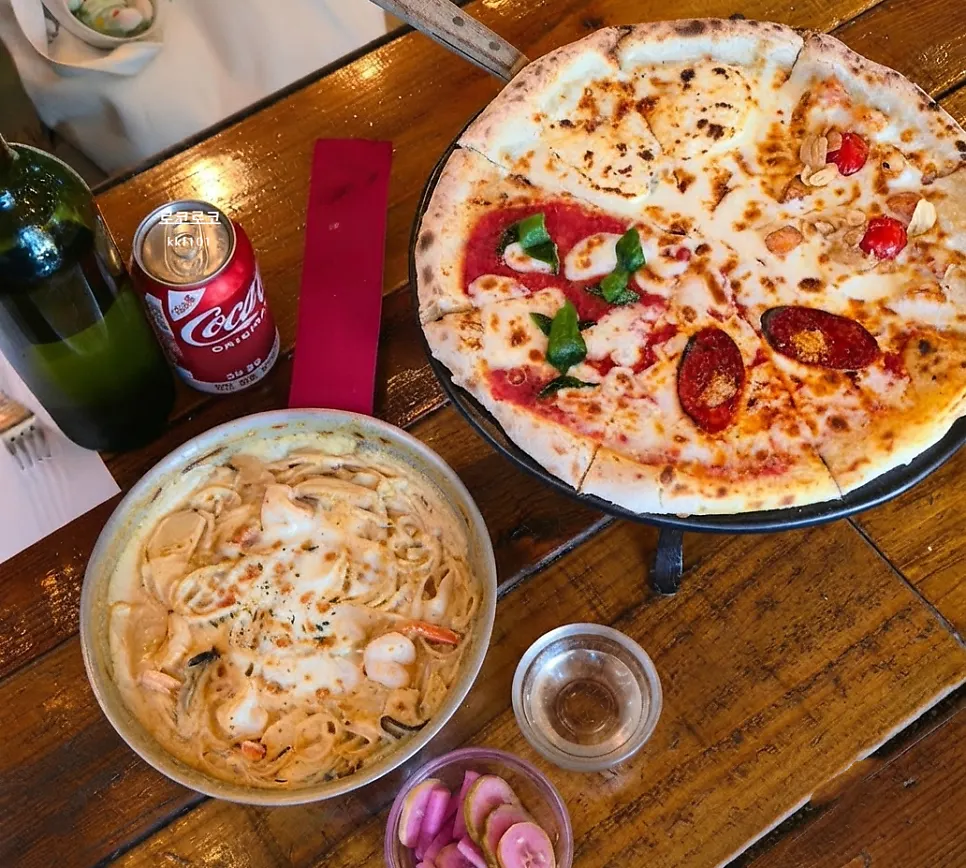 Wood-fired oven and cooking area at Hongdae Hwadeok Pizza