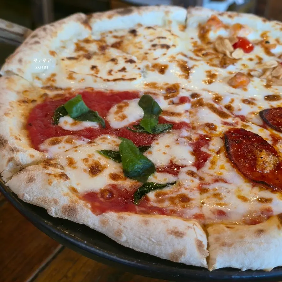 Whole Quattro Stagioni pizza with four flavors