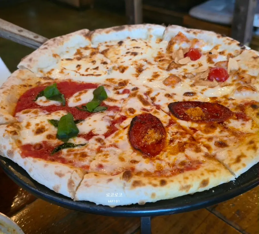 Wood-fired pizza dipped in the honey served alongside it