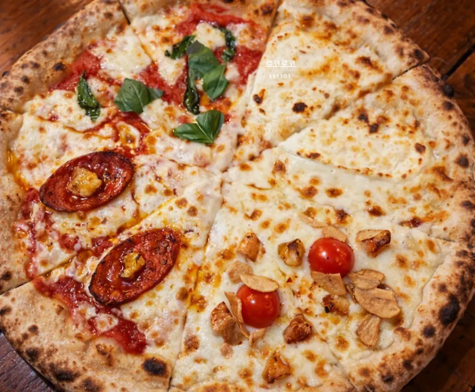 Table set with pizza and pasta together at Hongdae Hwadeok Pizza
