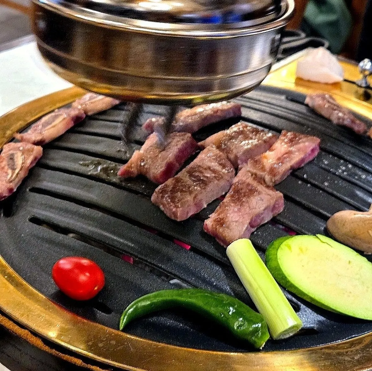 A golden-brown piece of grilled seolhwa galbi