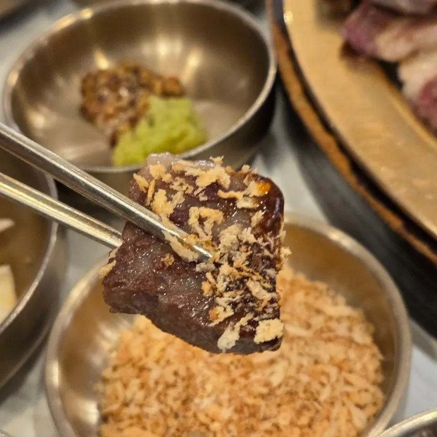 Gnawing meat off the bone of the seolhwa galbi
