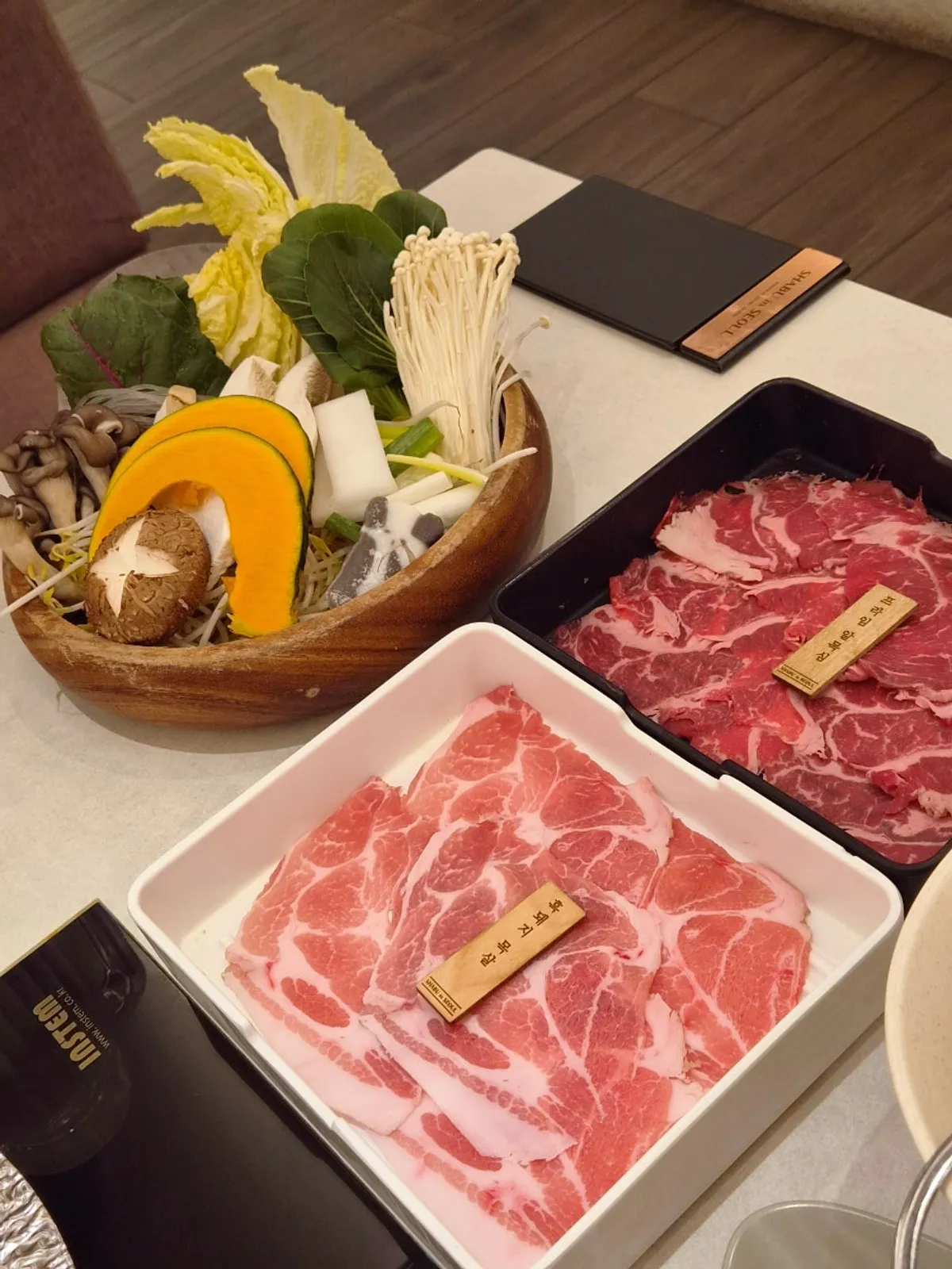 A neatly set table at Shabu in Seoul Hapjeong Branch