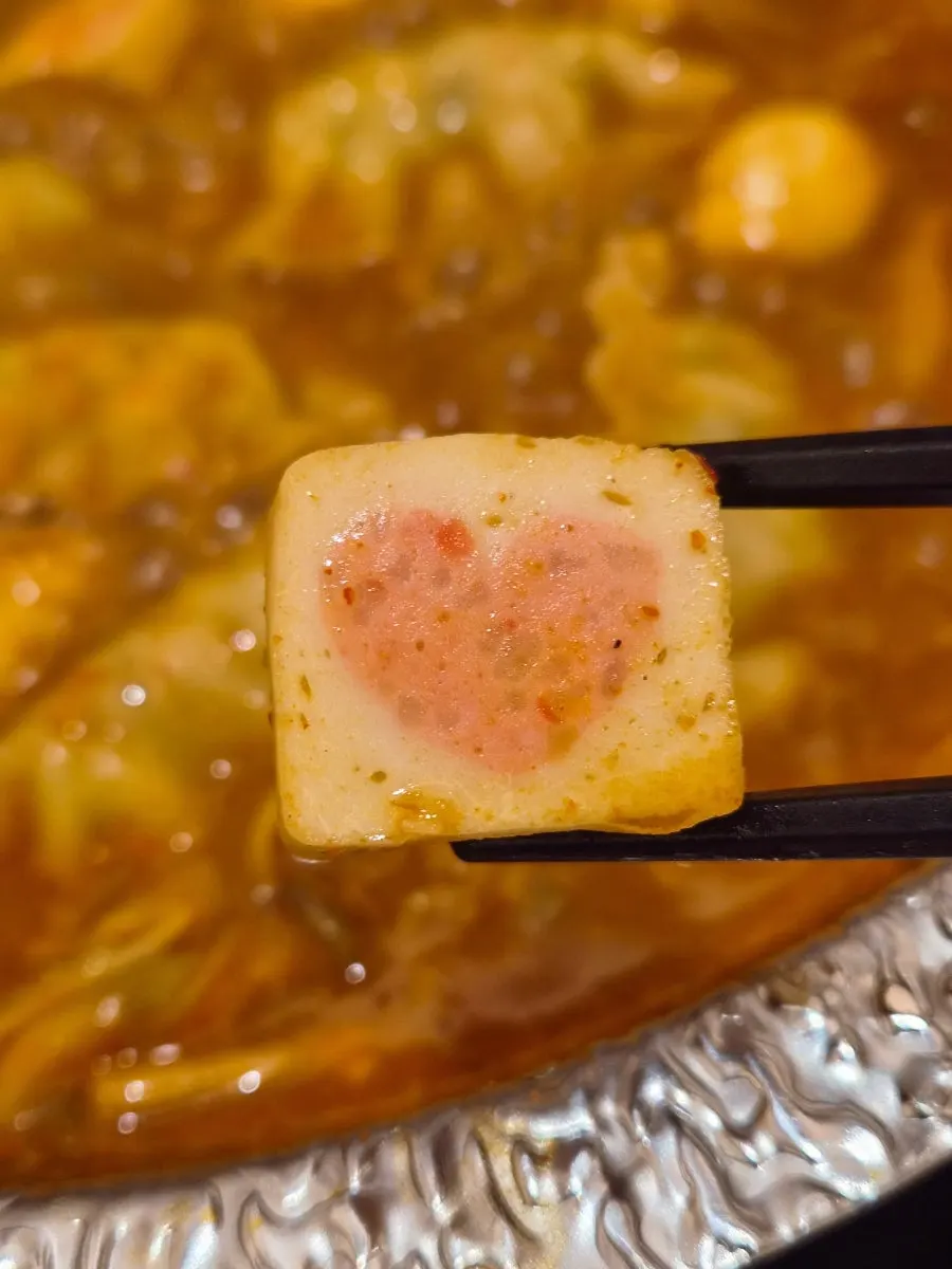 Mixed fishballs boiling in the broth