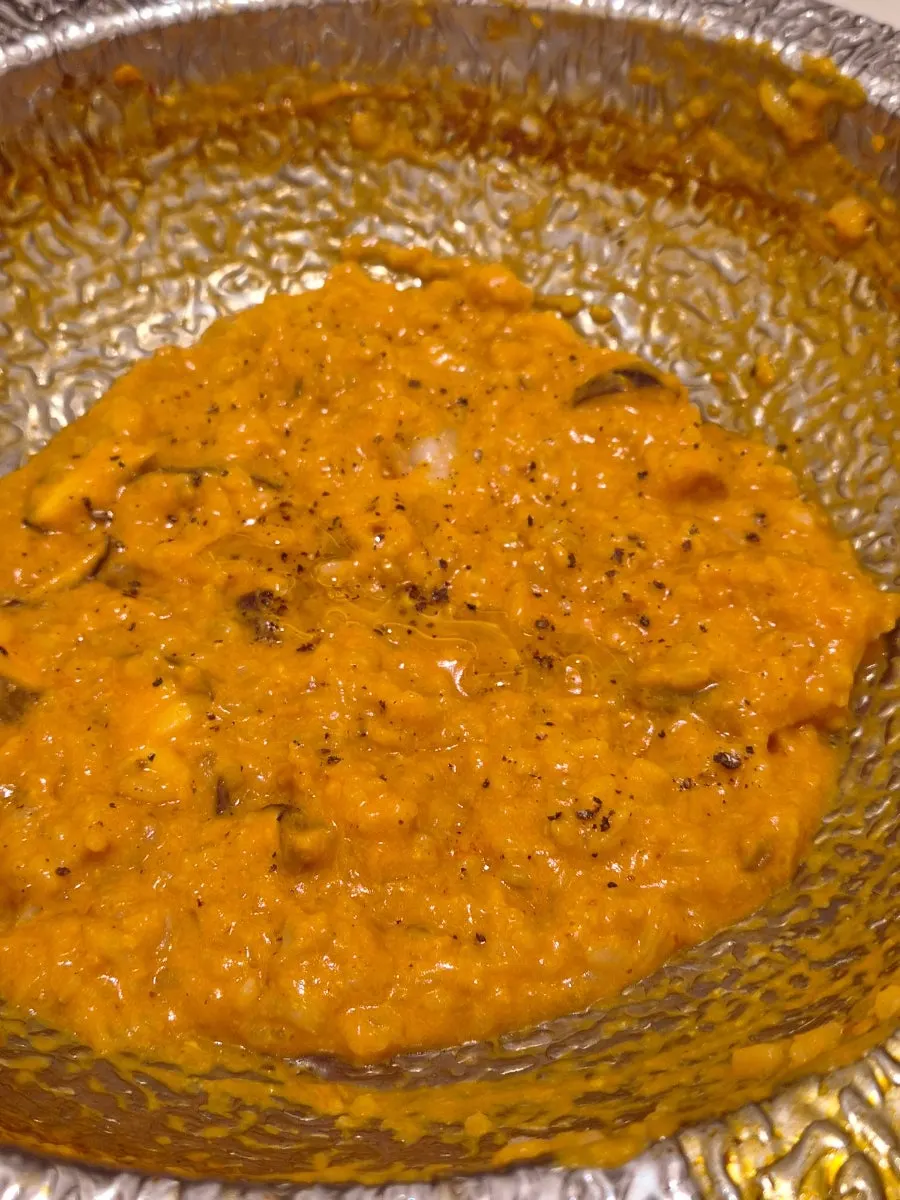 Rose risotto being prepared to finish the meal
