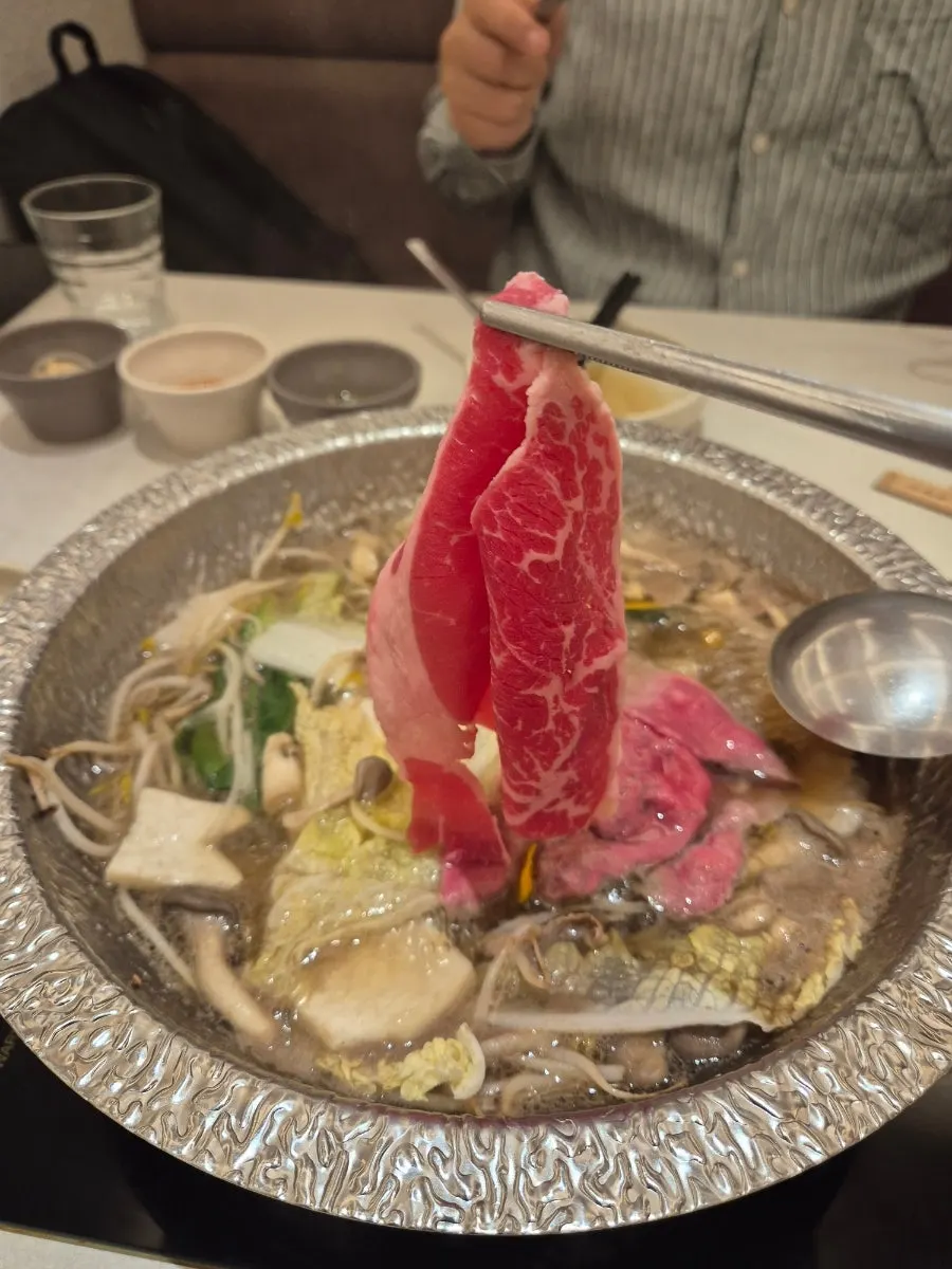 Plate of cooked meat dipped in sauce