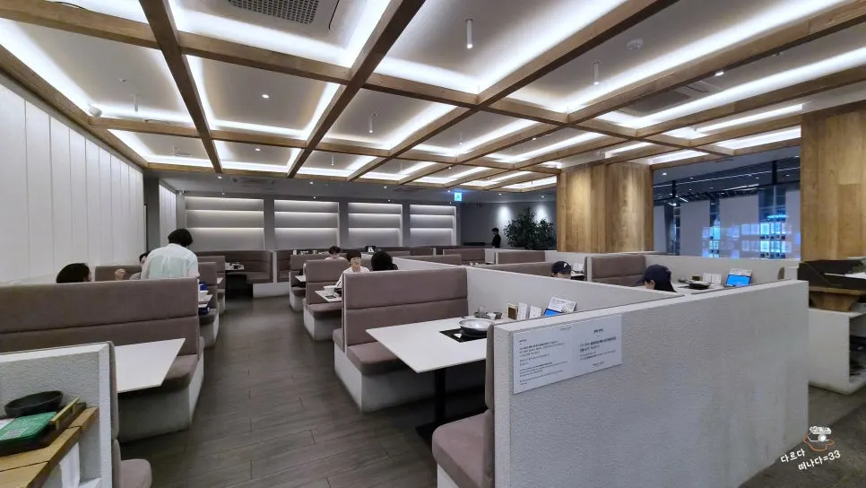 Hall with wood grid ceiling and soft lighting