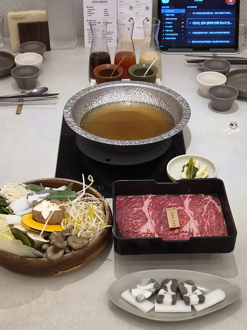 Full spread of prime Angus chuck flat and clear mushroom broth