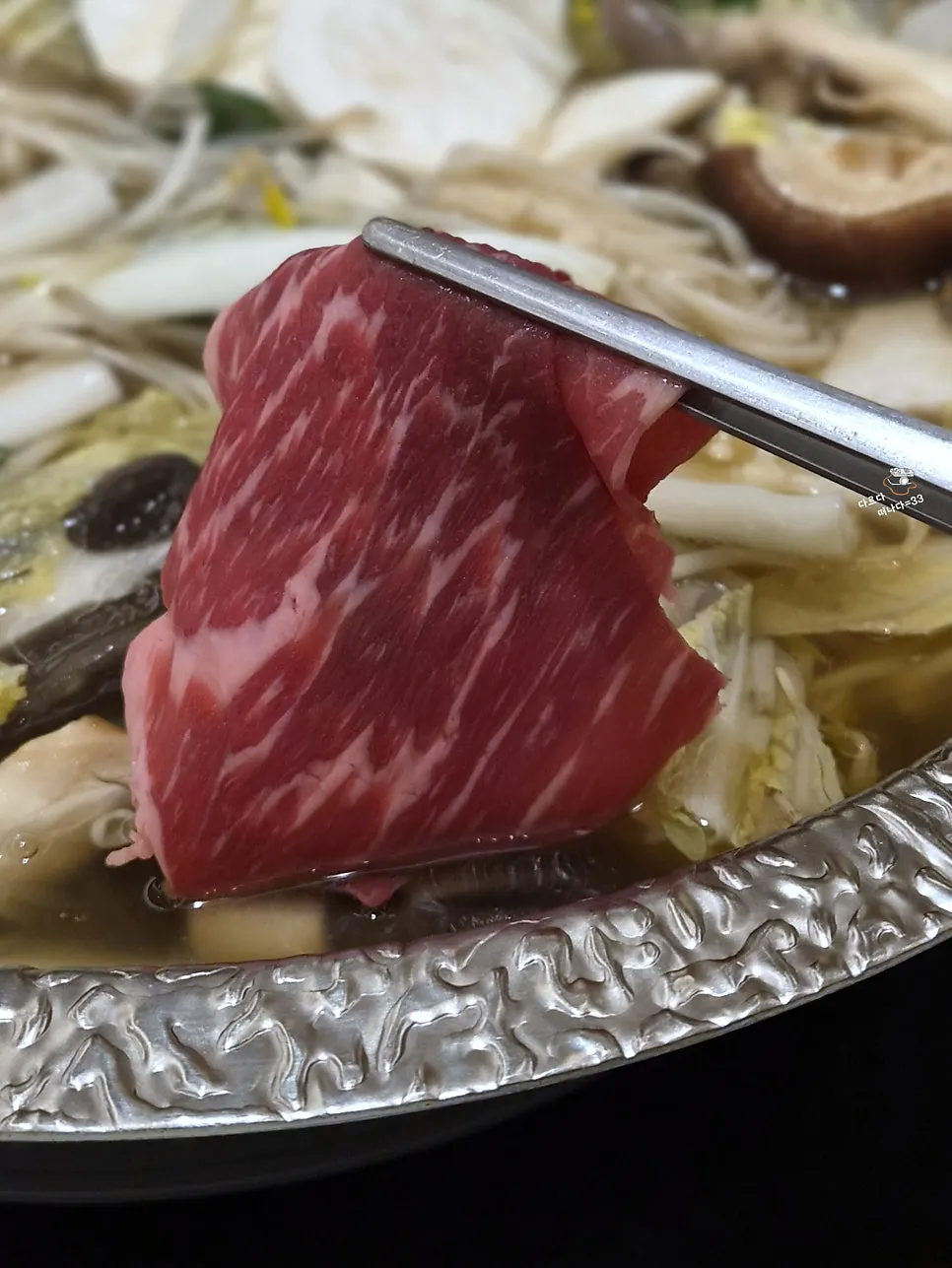Close-up of meat and vegetables in the broth