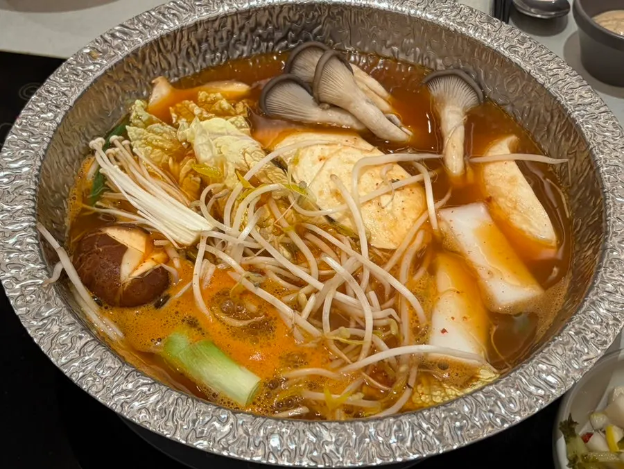 Mushrooms and vegetables added into the broth