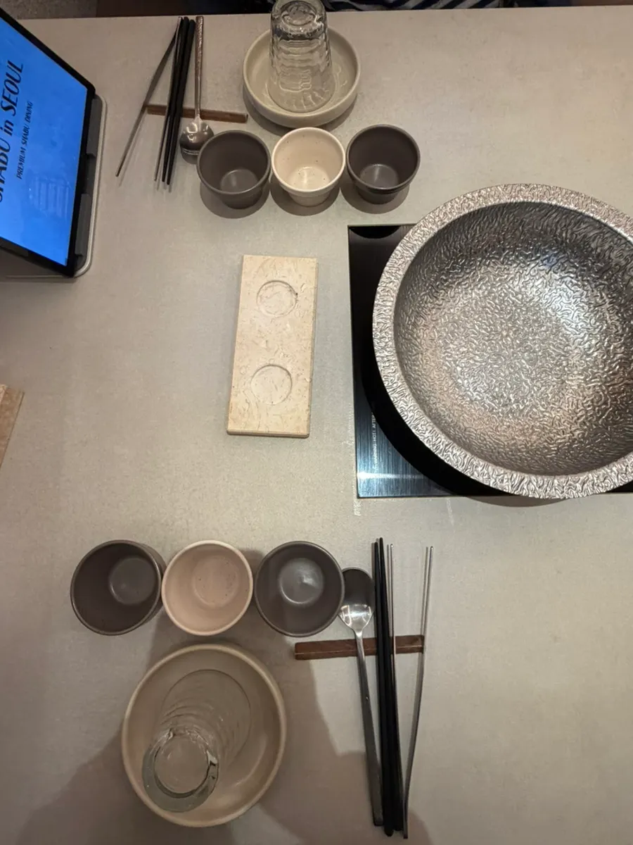 Table setting with sauce dishes and small plates
