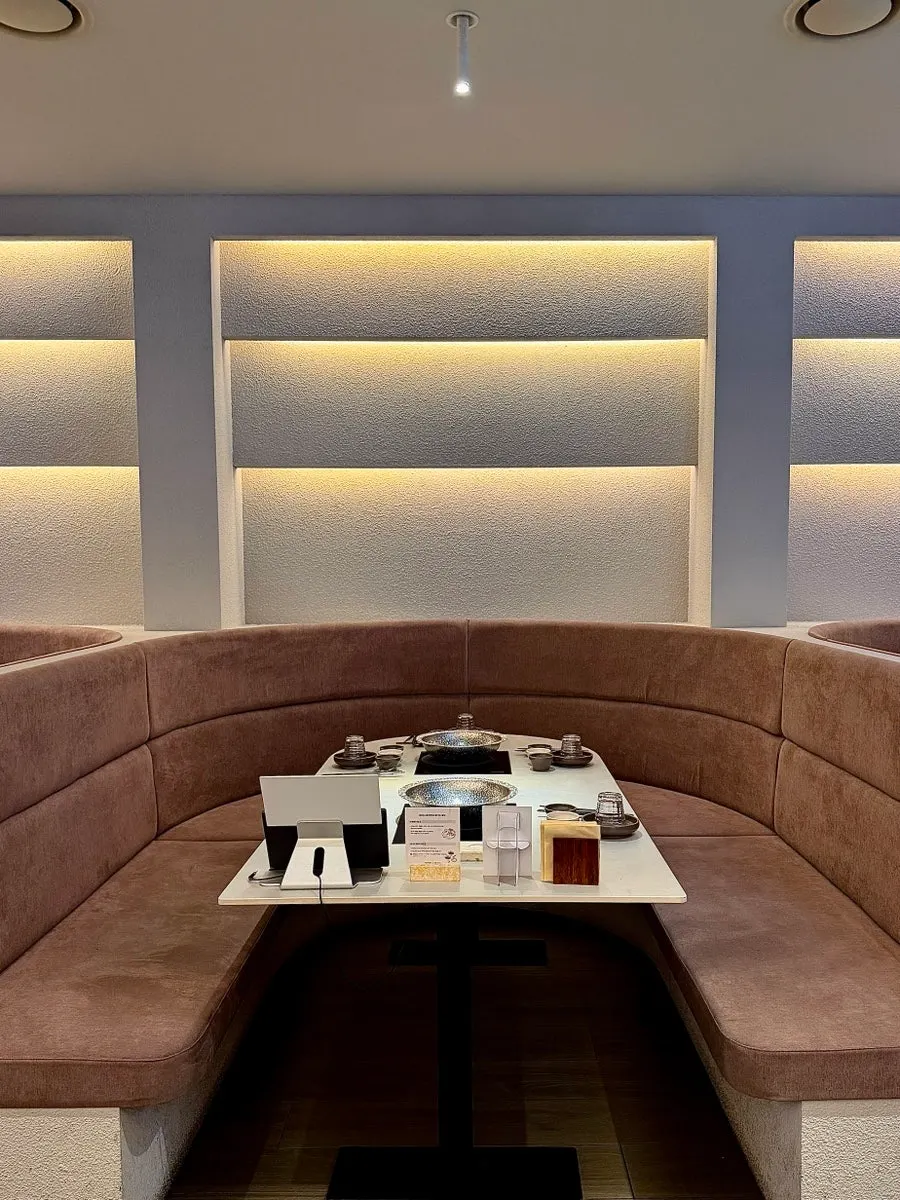 Interior of Shabu in Seoul Hapjeong Branch with high-back sofa seating