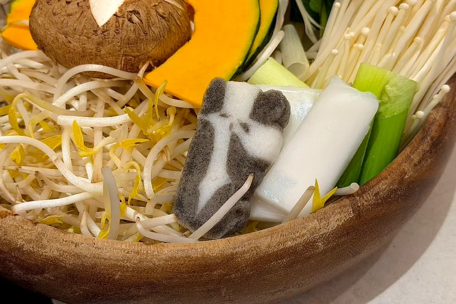 Shabu-shabu vegetable spread including napa cabbage, bok choy, and bean sprouts