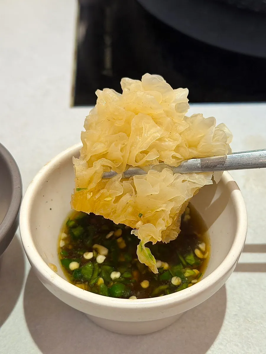 White fungus mushroom dipped in soy sauce