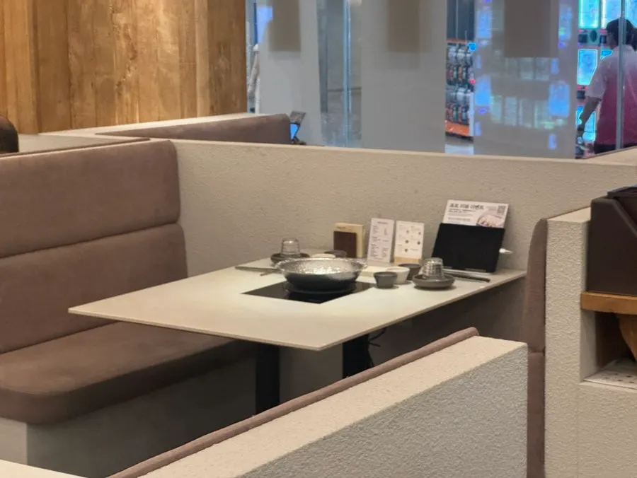 Interior of Shabu in Seoul Hapjeong Branch with warm lighting