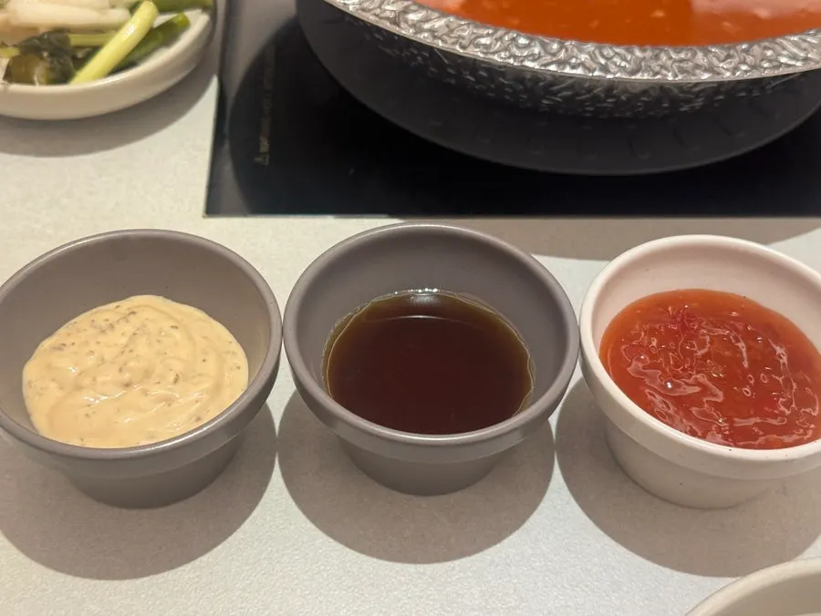 Neatly arranged tableware and sauce dishes