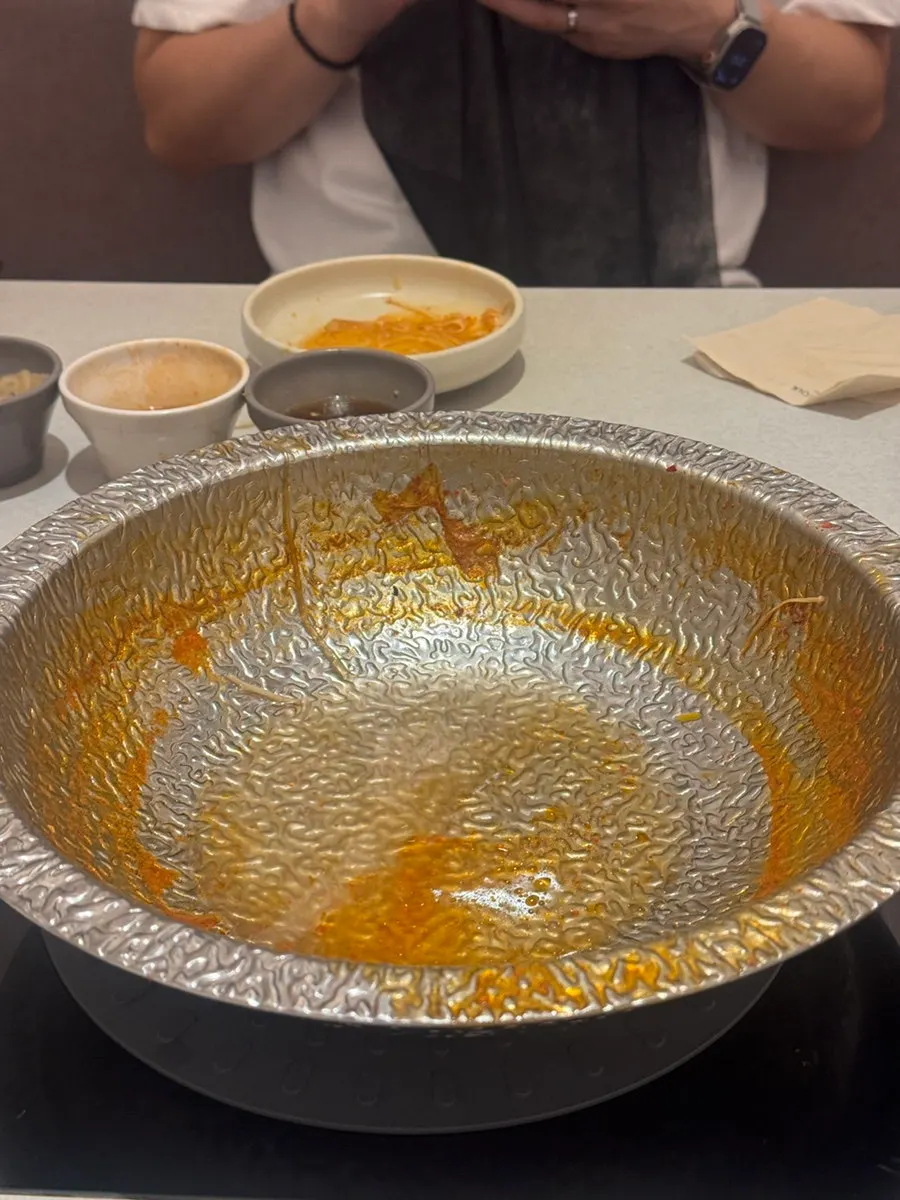 Rose risotto being prepared as the finishing dish