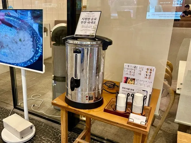 Entrance of Shabu in Seoul Hapjeong Branch with drinks for waiting guests
