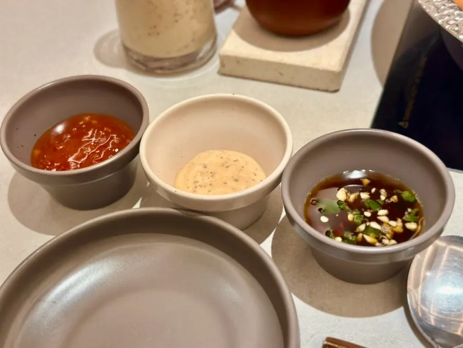 Three shabu sauces served in glass bottles