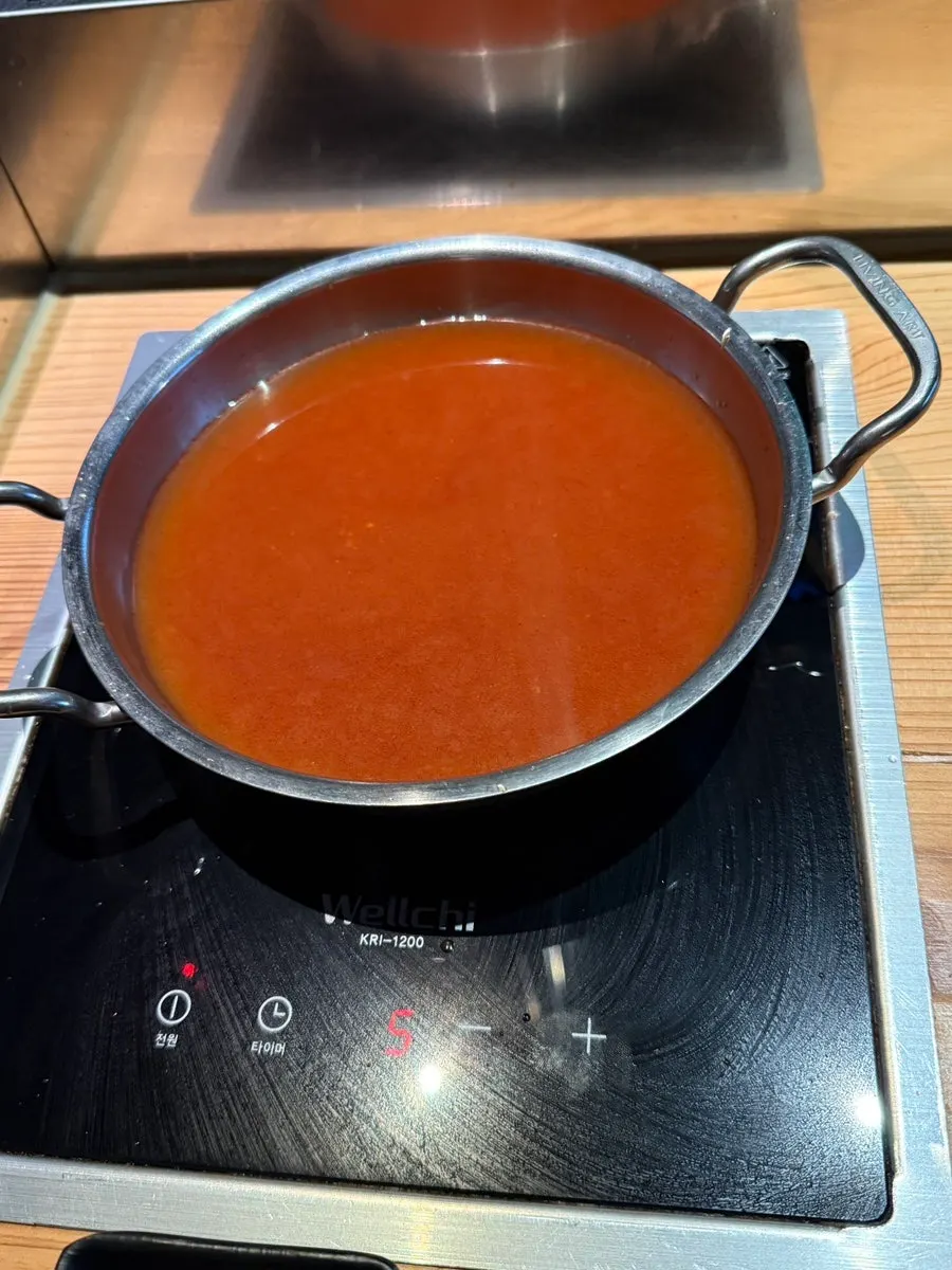 Plate of beef served with the spicy broth shabu